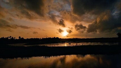 Obraz premium sunset over the river