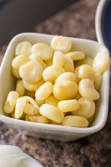 Boiled corn on little white bowl