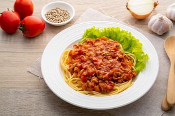 Spaghetti with minced Pork and Tomato Sauce on white plate