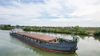 Sea freight. An old dry-cargo ship stands on the river on the Volga