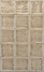 Glossy beige tiles background close up