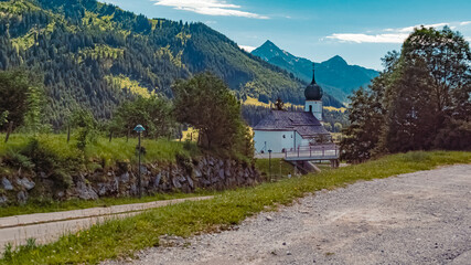 Beautiful alpine summer view with a church at the famous Tannheimer Tal valley, Graen, Tyrol, Austria