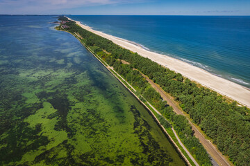 Summer view from the air of the Hel Peninsula, a calm and nice landscape over Jurata village.