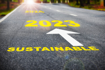 2023 to 2024 sustainable on asphalt road surface with marking lines. Sustainable future concept and Inspiration with motivation idea