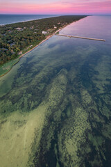 Summer view from the air of the Hel Peninsula, a calm and nice landscape over Jurata village.