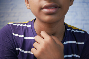teenage boy suffering throat pain close up 