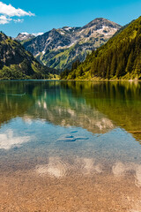 Beautiful alpine summer view with reflections at the famous Vilsalpsee, Tannheimer Tal valley, Tyrol, Austria