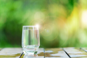 Drinking glasses set on a wooden bar