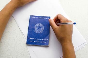 Translation: 'Federative Republic of Brazil, Ministry of Labour'. Brazilian notebook. Concept of...
