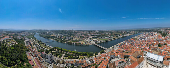 An aerial panoramic view of Mondego River in Coimbra