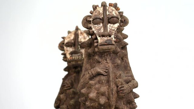African statues of terracota on white background. Couple of sculpture. 4:4:2 10bits ProRes 4k60p