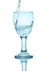 pouring water into glass isolated on white background