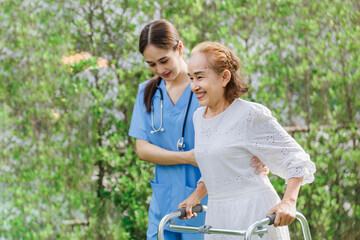 Asian young woman nurse at nursing home take care, patient and woman nurse  walk in the park, man...
