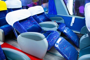 Bus seats, comfortable and reclining in blue colors.