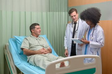 Fototapeta premium Caucasian doctor is examining and consulting to senior patient in hospital.