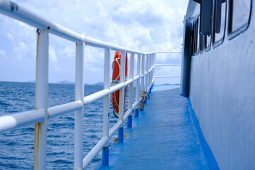 The deck of the ferry sails across the Andaman Sea on a hot summer day. Tropical sea views from the...