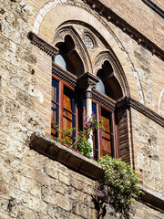 Fototapeta premium Medieval window in the streets of San Gimignano, Tuscany