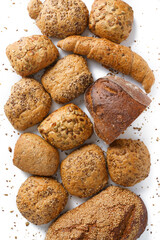 Bread assortment from various bakery products, white background, simple isolation