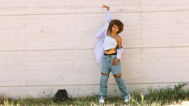 latin african american girl dancing in the street