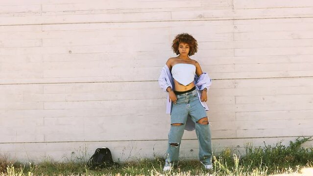latin african american girl dancing in the street