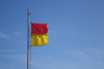 Hazard warning flags on the beach