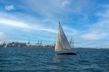 Sailing yacht regatta. Sailboats under sail in the race. Yachting. Luxury yachts.