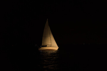 sailing yacht at night