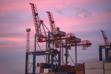 industrial port with containers. Stacks of containers in port at terminal. Berthing cranes