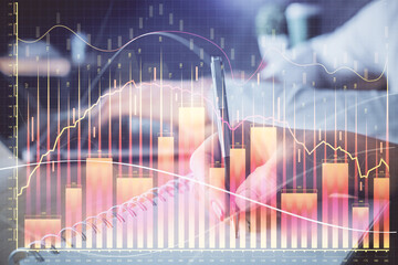 Double exposure of forex chart drawing over people taking notes background. Concept of financial analysis