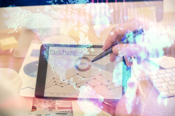 Double exposure of man's hands holding and using a phone and financial chart drawing. Market analysis concept.