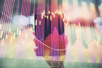 Double exposure of forex chart sketch hologram and woman holding and using a mobile device. Financial market concept.