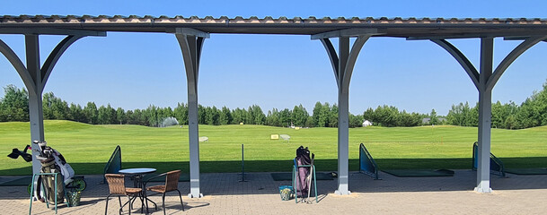 Training golf range bags and clubs . Golf game