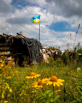 The flag of Ukraine flies over Ukrainian positions in the combat zone. War in Ukraine.