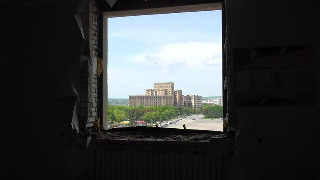 2022 - the central square in Kharkiv as seen through a window at the destroyed central government building.