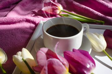 Cup of coffee tulip flower in the room