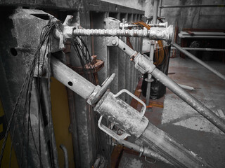Cast-in-place concrete works. Scaffolding structures. Metal props hold formwork at construction...