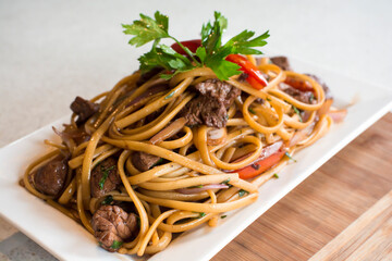 Tallarines con lomo saltado noodles with sauted meat peruvian gourmet restaurant food