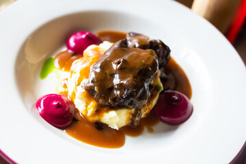 beef cheek with mashed potatoes and currant oil