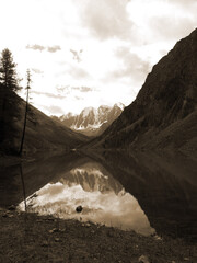 Vintage misty landscape with hills and rocks  in sepia tones.