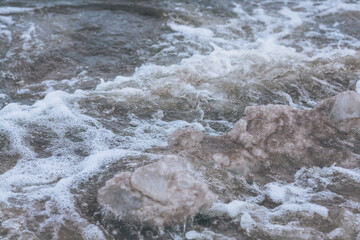 Rushing sea water. Background with sea foam