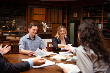 The senior professor gives a lecture to the students at the University library