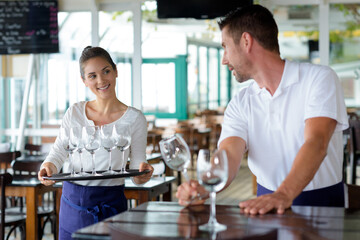 two bartedners are at work