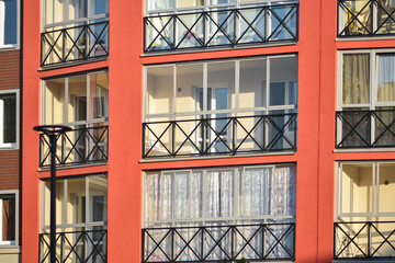 The stylish facade of a residential building with beautiful windows is a new residential quarter of European residential buildings. Abstraction in the city. Kirov.
