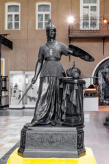 warrior in armor with sword and shield cast iron sculpture