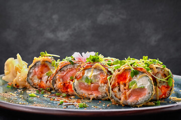 Warm roll with salmon, tiger prawn, eel, avocado. selective focus