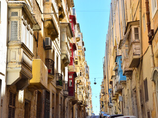  Street view of Valletta; traditional colorful balconies in the old city of Valletta,  Maltese residential architecture, windows