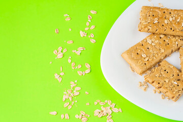 Oatmeal bar on a white plate, ready for breakfast copy space