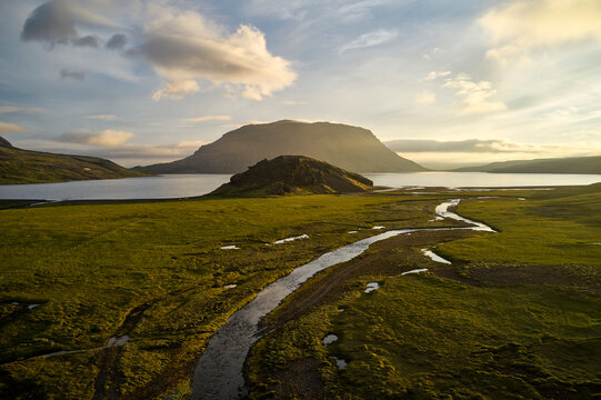 River flowing towards lake in morning