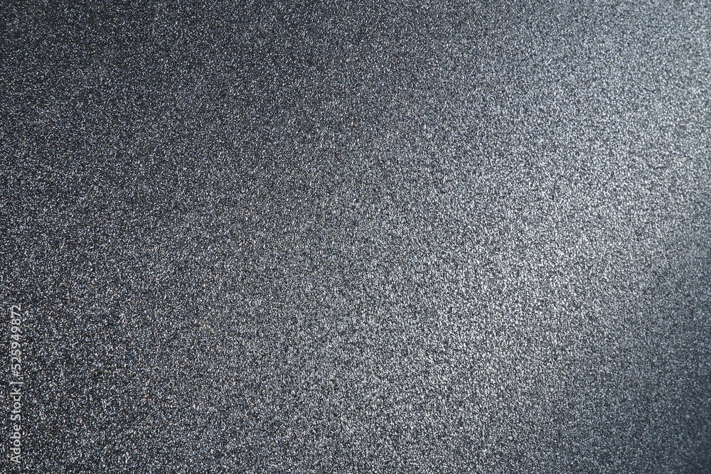 Poster black or dark gray background with shine. texture of rough paper or cardboard. defocused bokeh spark