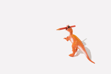Creative idea made of dinosaur with crayon on white background. Minimal happy childhood or back to...